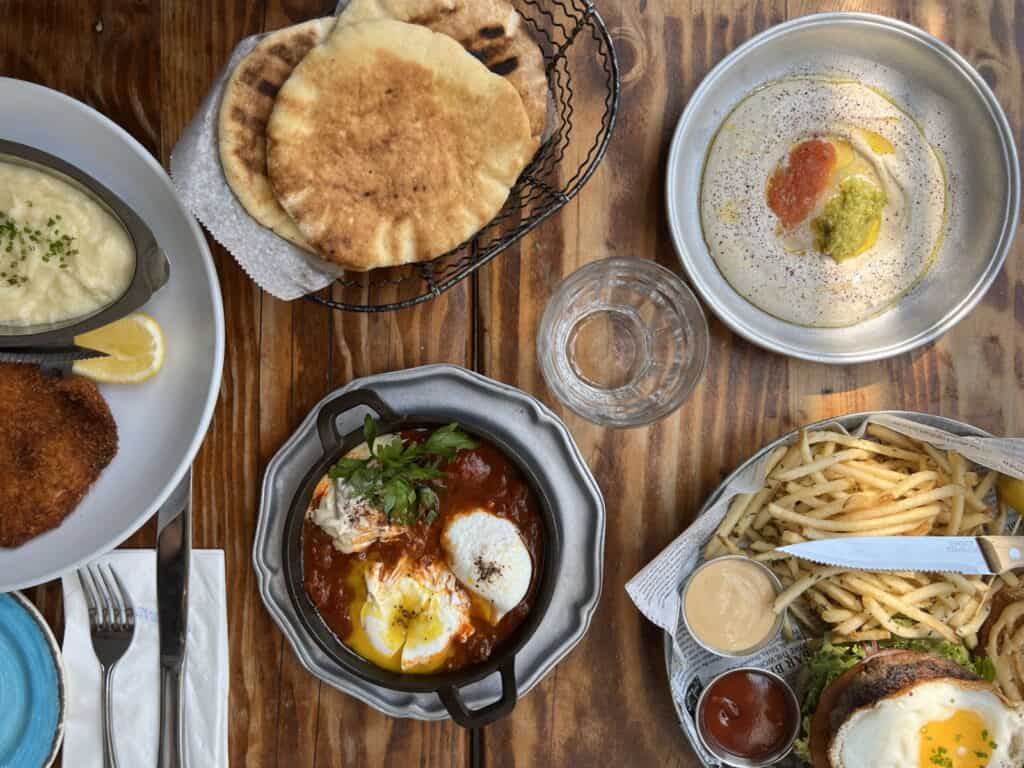 araffy meal of eggs, bread, and french fries on a table