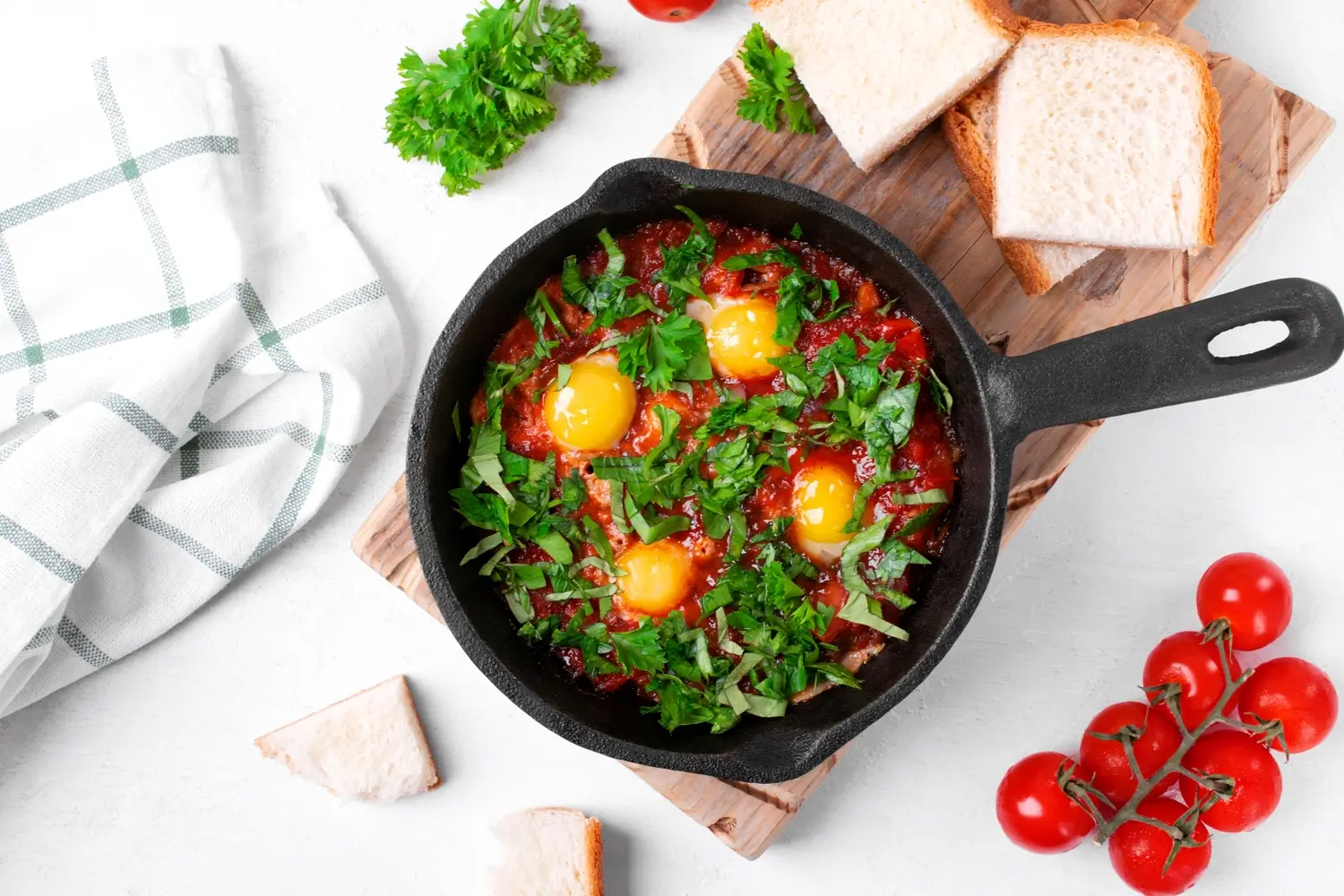 a close up of a pan of food with bread and tomatoes