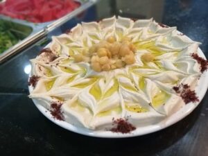 there is a cake with white frosting and yellow flowers on it