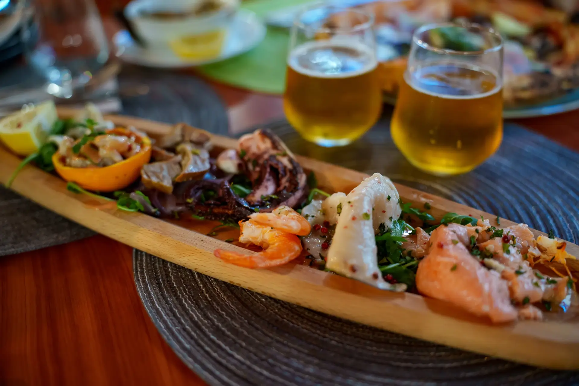 Mediterranean seafood platter with salmon, shrimp and beer at 19 Cleveland, Soho NYC