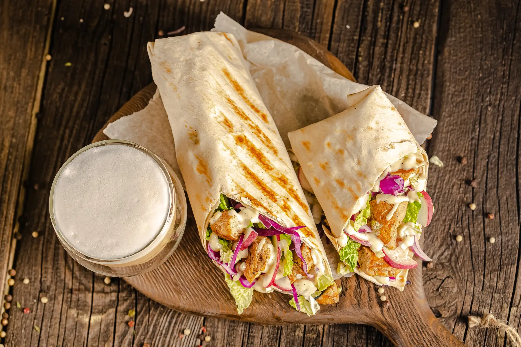 Grilled chicken wraps with fresh veggies and beer at 19 Cleveland, Soho NYC
