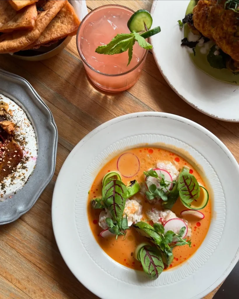 Mediterranean mezze plates including hummus, smoked eggplant, and fresh salads at 19 Cleveland in SoHo