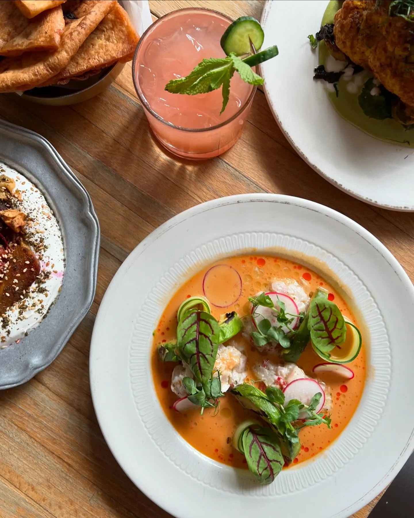 Mediterranean mezze plates including hummus, smoked eggplant, and fresh salads at 19 Cleveland in SoHo